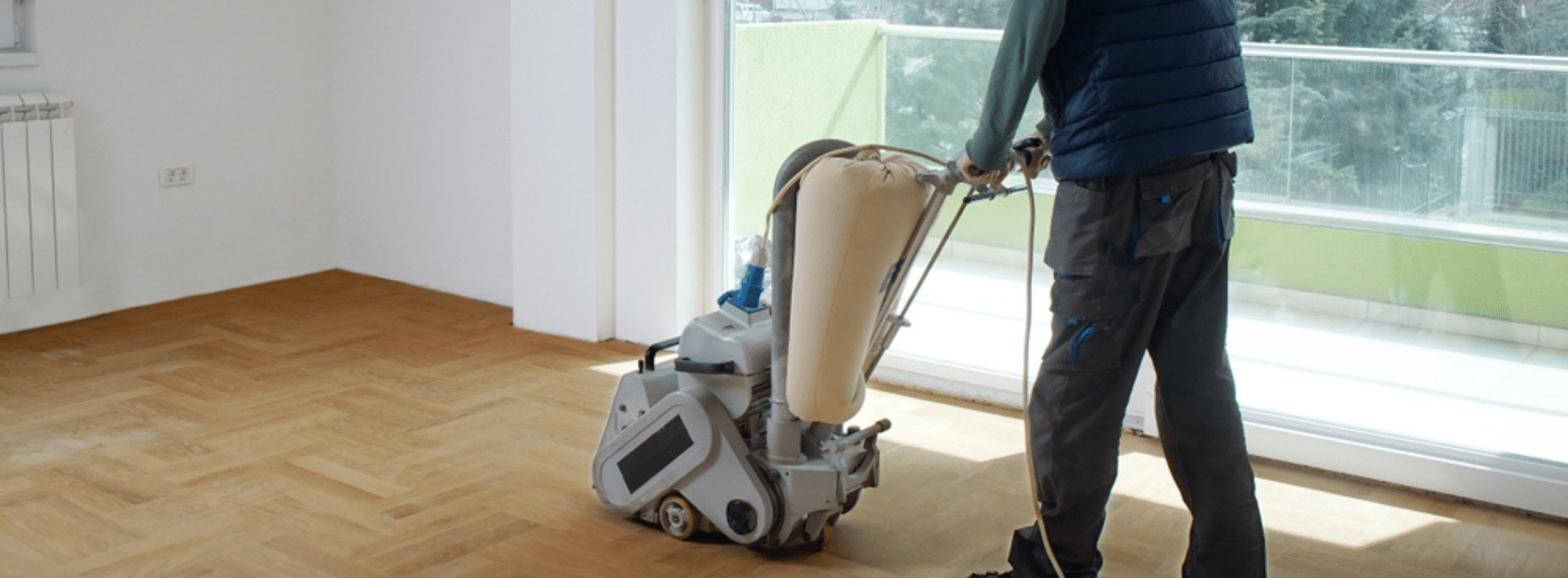 In Norwood Green, UB2, Mr Sander® are using a Bona Scorpion drum sander with a dimension of 200 mm, 1.5 kW power, 240 V voltage, and 50 Hz frequency. They are also utilizing a dust extraction system with a HEPA filter for optimal cleanliness and efficiency while sanding a parquet floor.