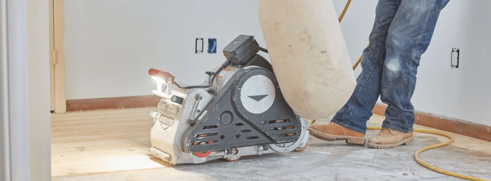 Mr Sander® utilising a 2.2kW, 220V Bona belt sander on a parquet floor in Bow, E3. The HEPA-filtered dust extraction system ensures a clean, efficient sanding process, showcasing the team's commitment to providing superior floor restoration results.