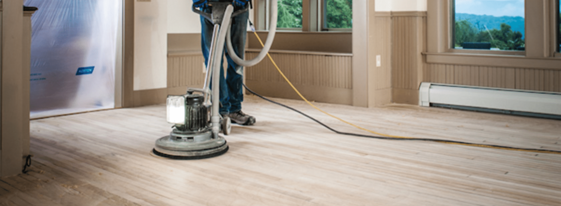 Mr Sander® in Brentwood, CM12, meticulously restoring a herringbone floor using a 2.2 kW Bona belt sander (230V, 50Hz, 200x750 mm). The HEPA-filtered dust extraction system guarantees a clean process, highlighting the company's commitment to quality and cleanliness.