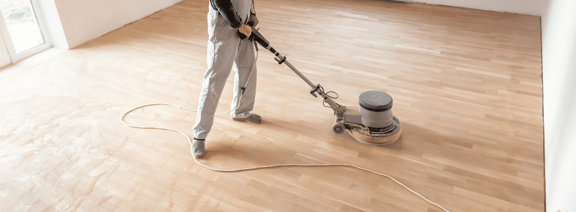 Expert floor sanding in Wapping, E1 using 2.2 kW Bona belt sander on herringbone pattern; 220V, 60Hz machine, size 250x750 mm, delivering impeccable restoration results.