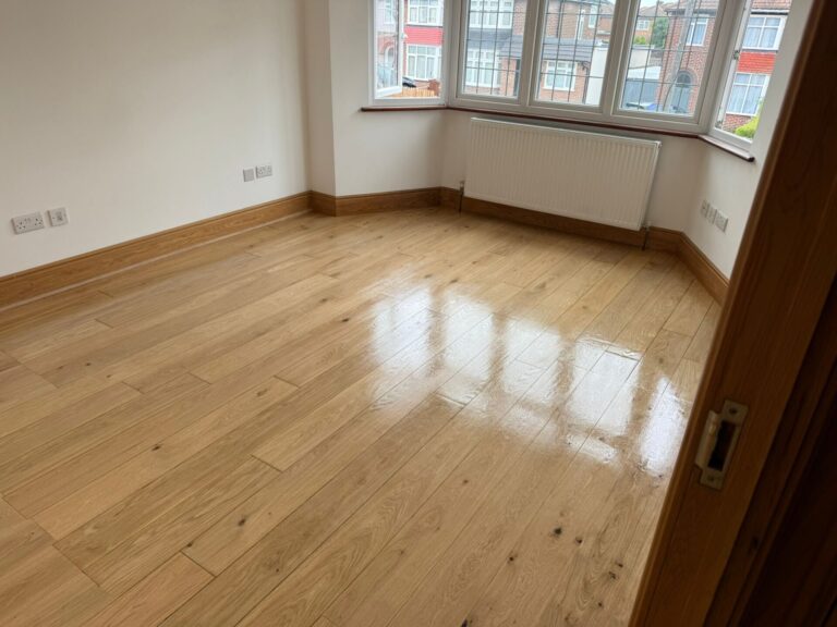 Oak engineered plank floor after sanding and sealing, high-gloss finish—illustrating 5 Underlay Myths about thickness, acoustics, and moisture control.