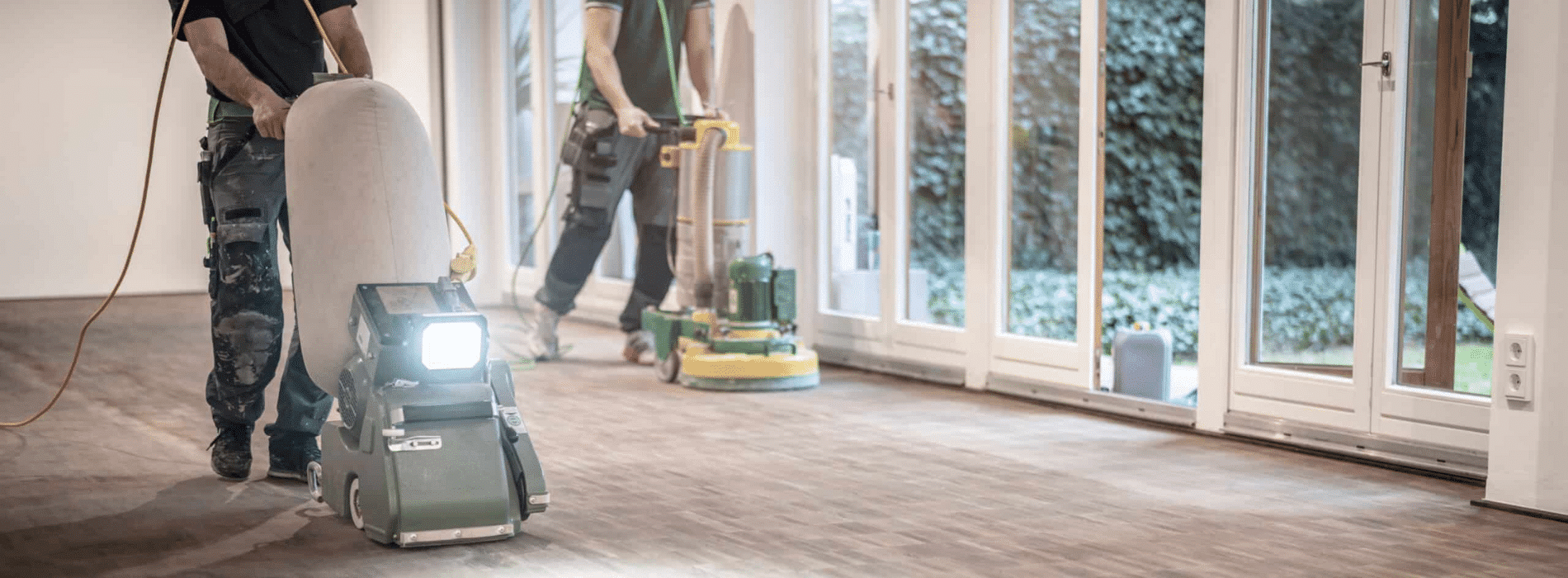 In Barnes, SW13, Mr Sander® skillfully sanding a herringbone floor using the powerful 2.2 kW Bona belt sander. The 220V, 60Hz machine, sized 250x750 mm, creates stunning results while the HEPA-filtered dust extraction system ensures cleanliness and efficiency.