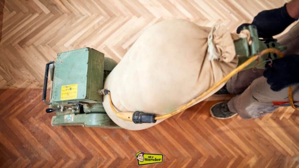 Professional floor sanding machine restoring wooden flooring to a smooth, polished finish