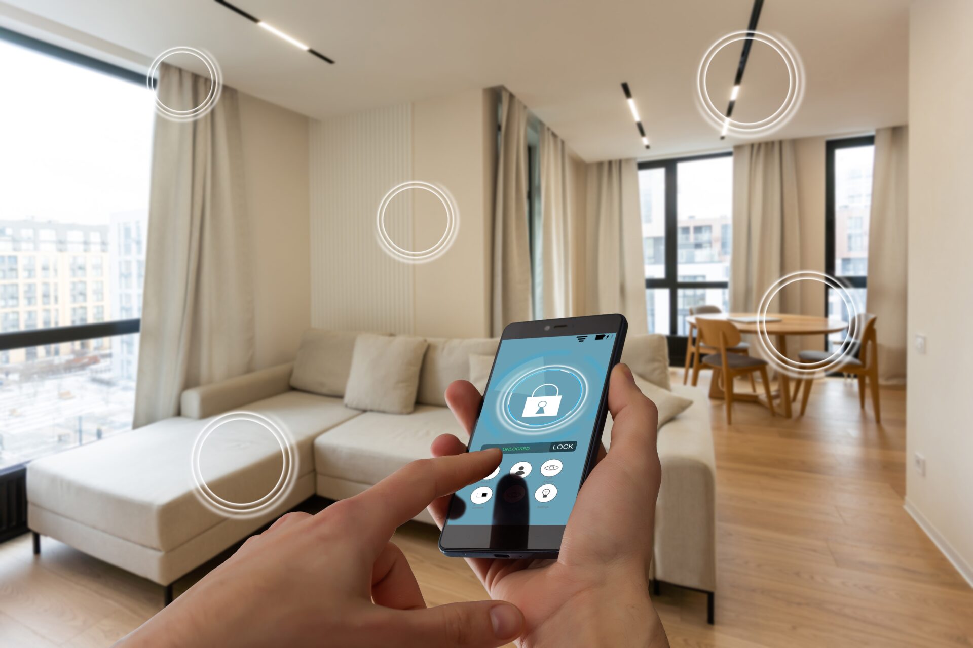 Smartphone controls home security in a bright apartment with sleek hardwood floor installation for smart homes.