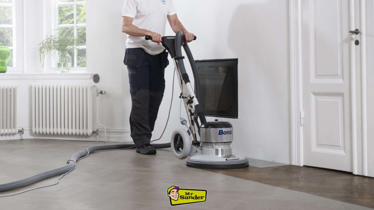 Professional floor sanding in progress in Cranford using a high-performance Bona machine, showcasing dust-free and precise floor restoration.