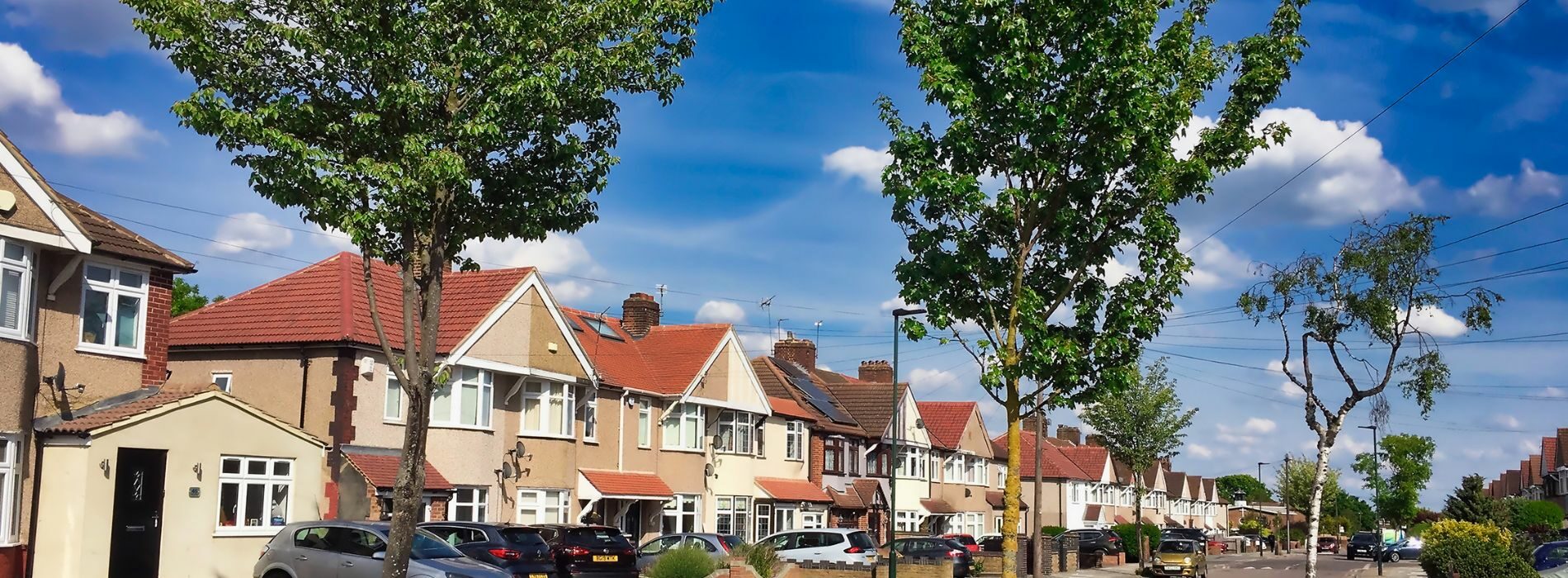 A row of houses on a residential street in Bexley, DA5, would typically consist of terraced houses. Terraced houses are attached properties that form a continuous row, sharing side walls with neighboring houses. They are a common housing type in many residential areas in the UK.
