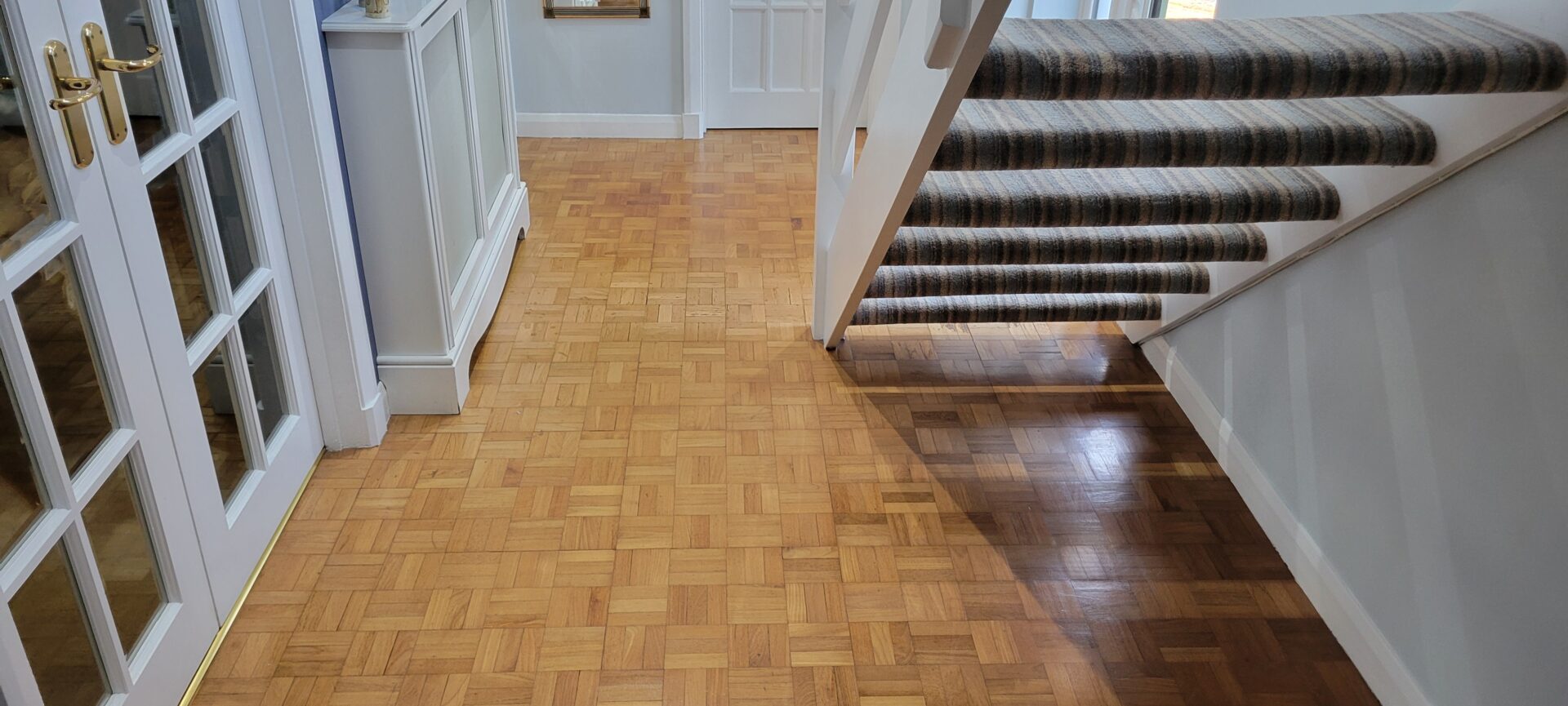 Entrance hall parquet floor showing traffic‑worn patches before Floor Sanding and Restoration