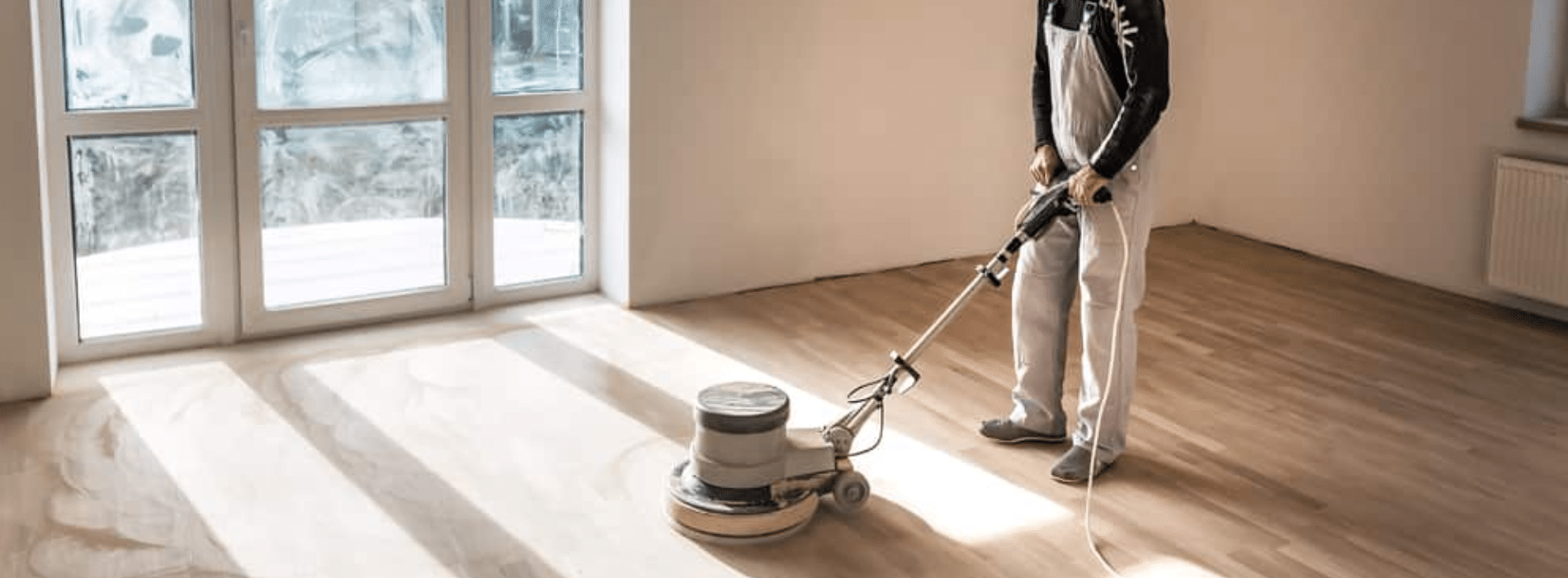 Mr Sander® skillfully sanding a herringbone floor using the powerful Effect 2200 Voltage 230 Frequency 50 Size 200x750 mm Bona buffer sander. The dust extraction system with HEPA filter ensures a clean and efficient process. Witness the expertise of Mr Sander® in Greenwich, SE10.