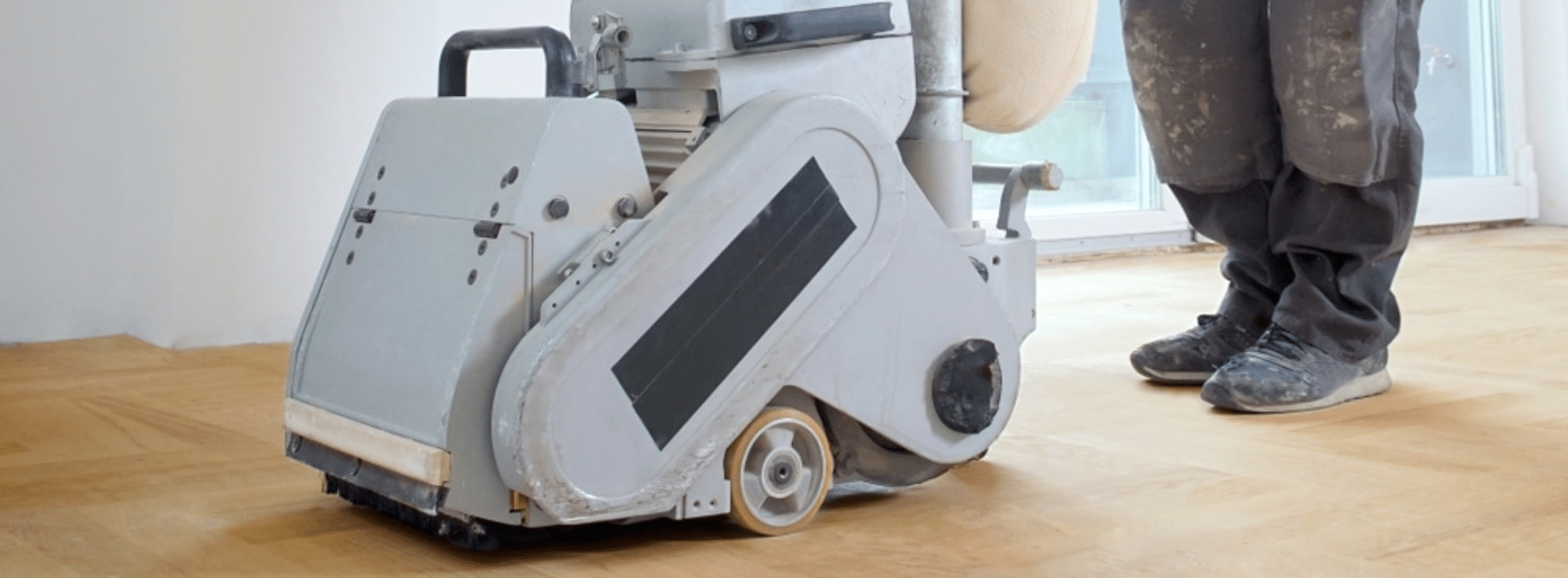 In Tilbury, RM18, Mr Sander® sanding parquet floor with Bona Belt Lite (2.2kW, 230V, 50Hz). Size: 200x750mm belt sander connected to HEPA-filtered dust extraction system for clean, efficient results.