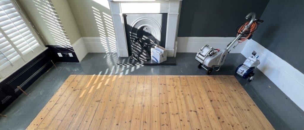 a vacuum cleaner next to a fireplace