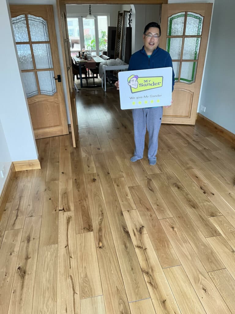 a man holding a sign in a room