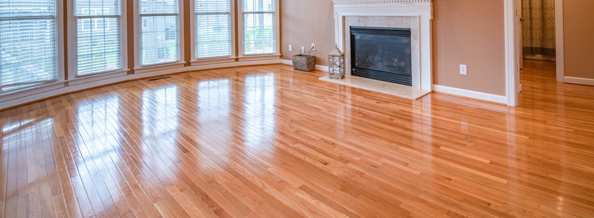 Expertly restored 7-year-old hardwood floor in Kilburn, NW6. Bona 2.2K Frost whitewashing and Traffic HD 15% sheen matte lacquer were used by Mr Sander®. The durable and stunning finish ensures long-lasting beauty.