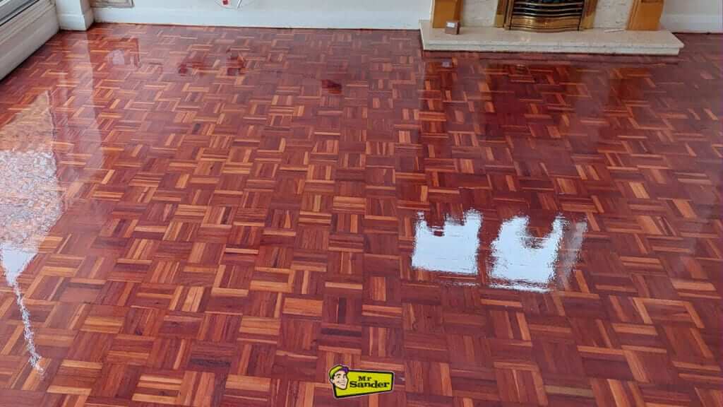 Restored glossy parquet floor after refinishing by Mr Sander in Loughton, UK.