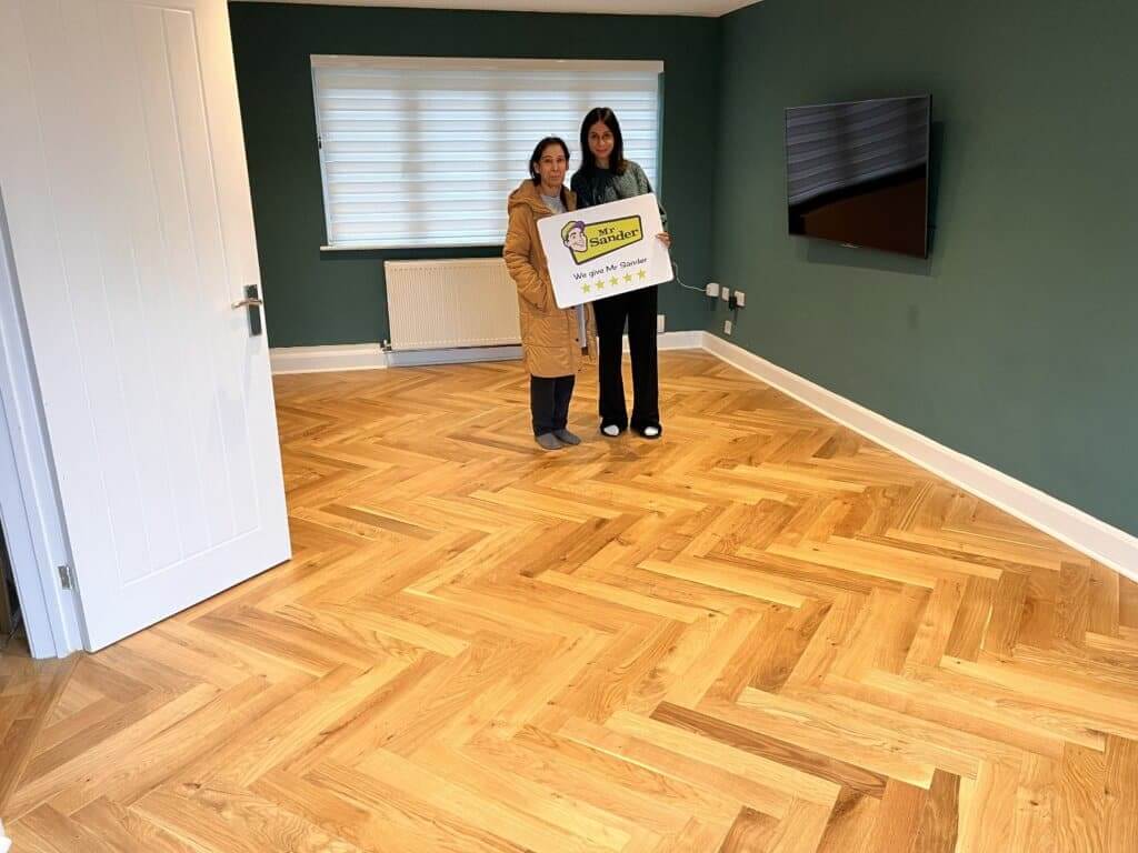 Parquet Floor Repair completed. Happy Clients of Mr Sander.