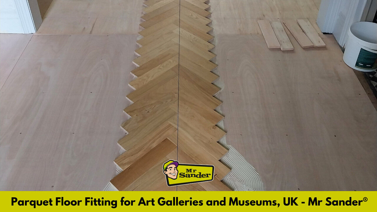 A herringbone parquet layout on a plywood subfloor, showcasing precise parquet floor fitting for art galleries and museums.