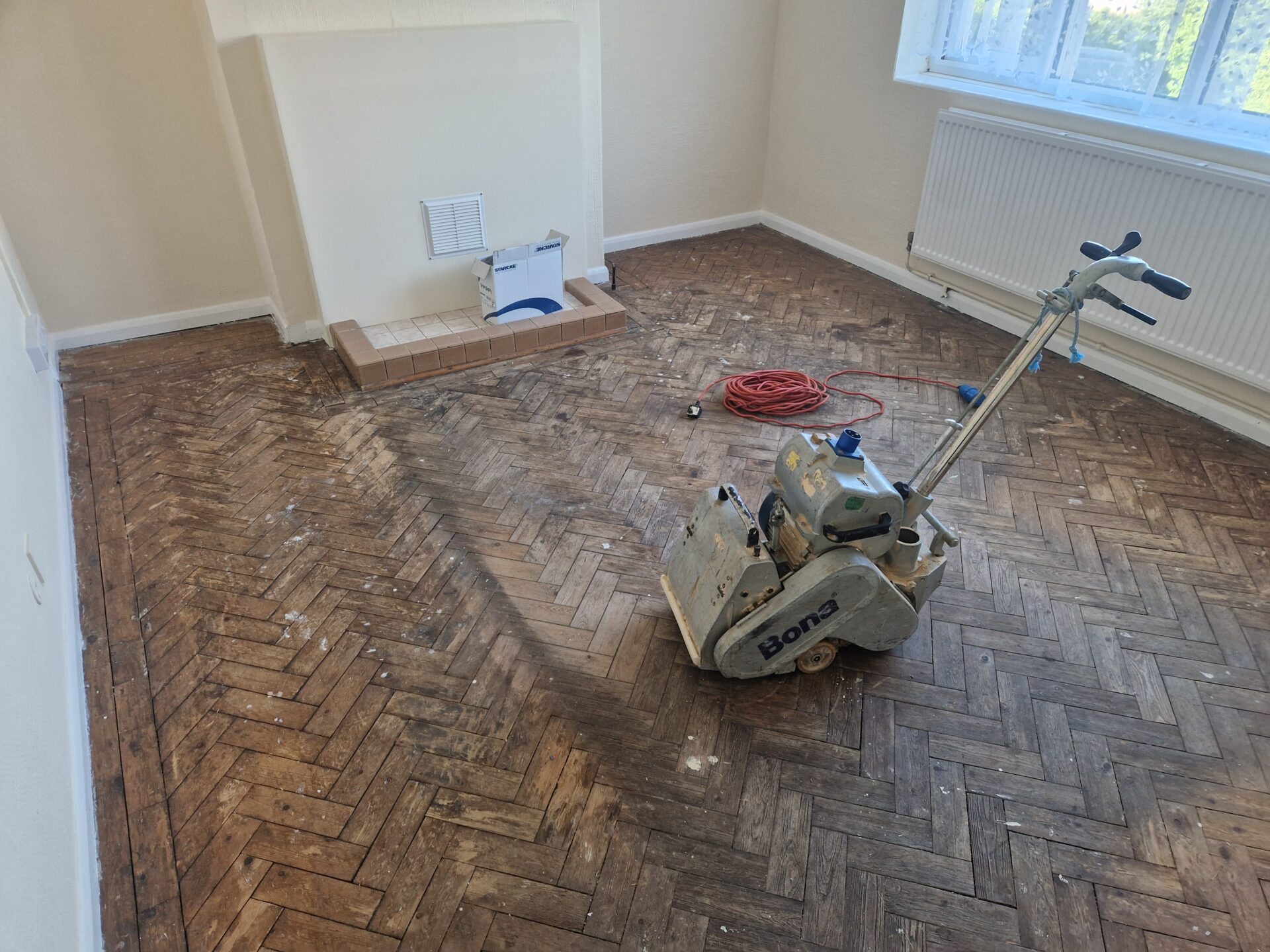 Parquet Floor Sanding process — staged grits, trowel fill, and multi-coat finishing to revive parquet