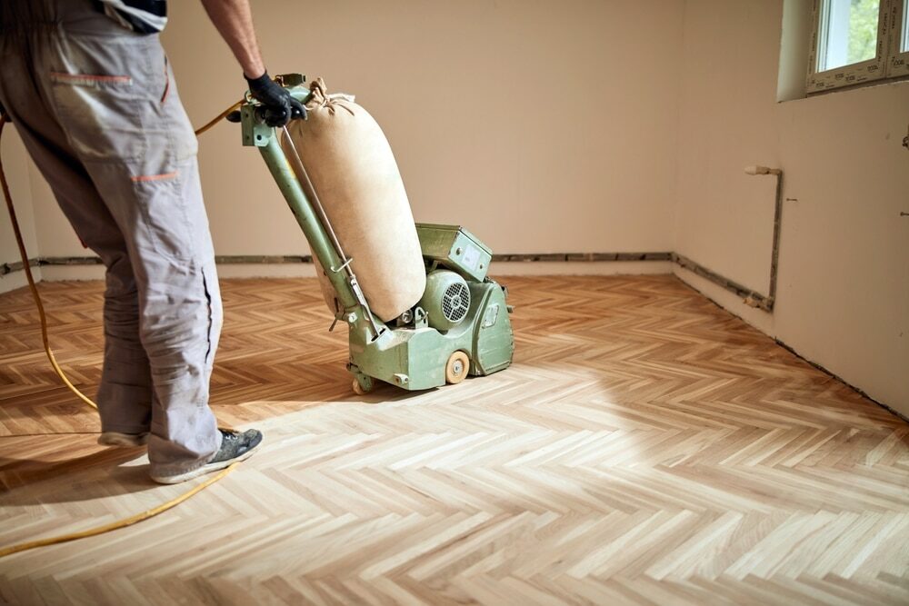 In Stratford, E15, Mr Sander® are meticulously sanding a herringbone floor using the powerful Bona Scorpion sander. With dimensions of 200mm and an impressive 1.5kW effect, this sander operates at 240V and 50Hz. It is equipped with distressing drums to beautifully texture wood floors.