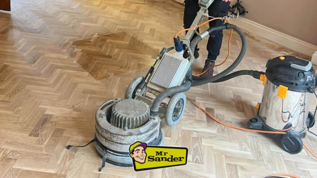 a person using a machine on a wooden floor
