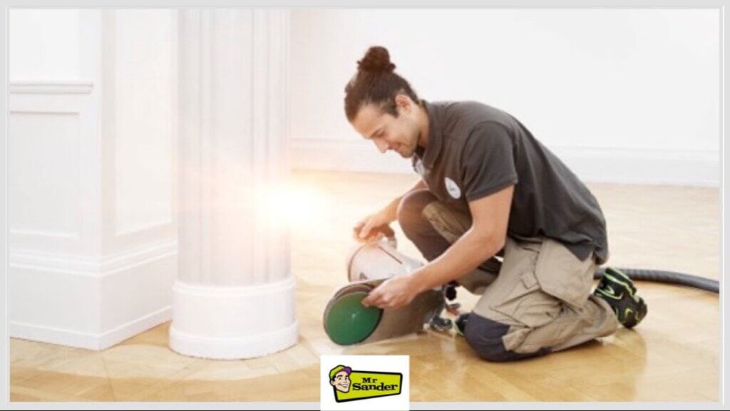 Precision floor sanding around decorative columns in Doune (FK16) by Mr Sander®️, ensuring a uniform restoration.