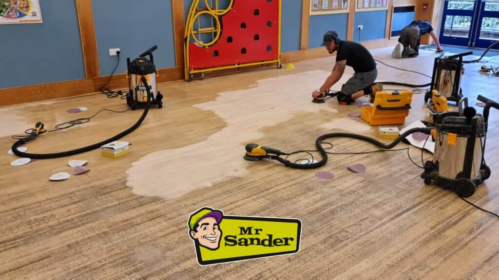 Mr Sander professionals sanding a school floor in London, UK