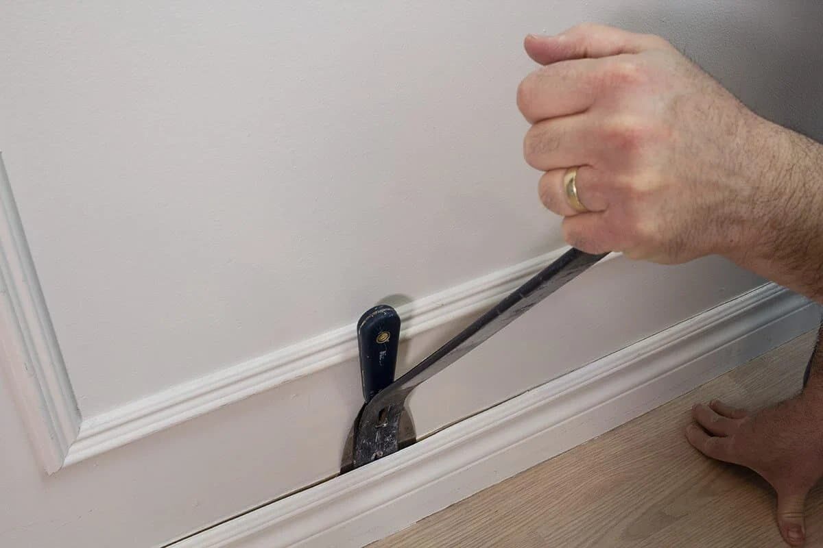 Remove baseboards and moulding