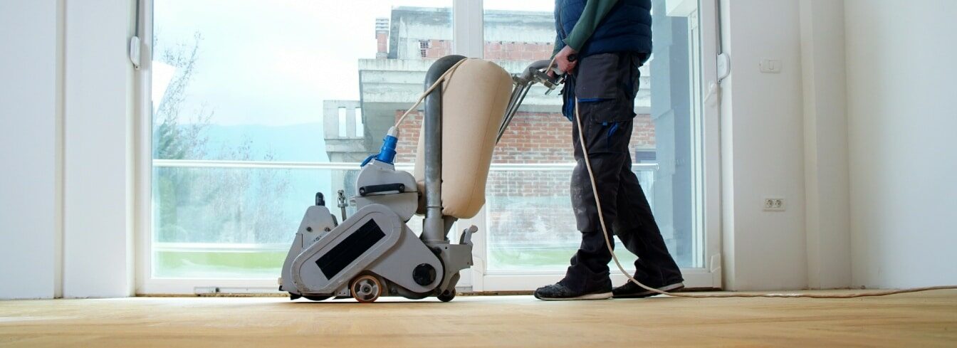A professional Mr Sander® using a Bona FlexiSand 1.9, a 407 mm diameter buffer sander, connected to a dust extraction system with a HEPA filter. The sander has a power of 1.9 kW and operates at 230 V and 50 Hz/60 Hz. The scene is set in Hillingdon, UB10.