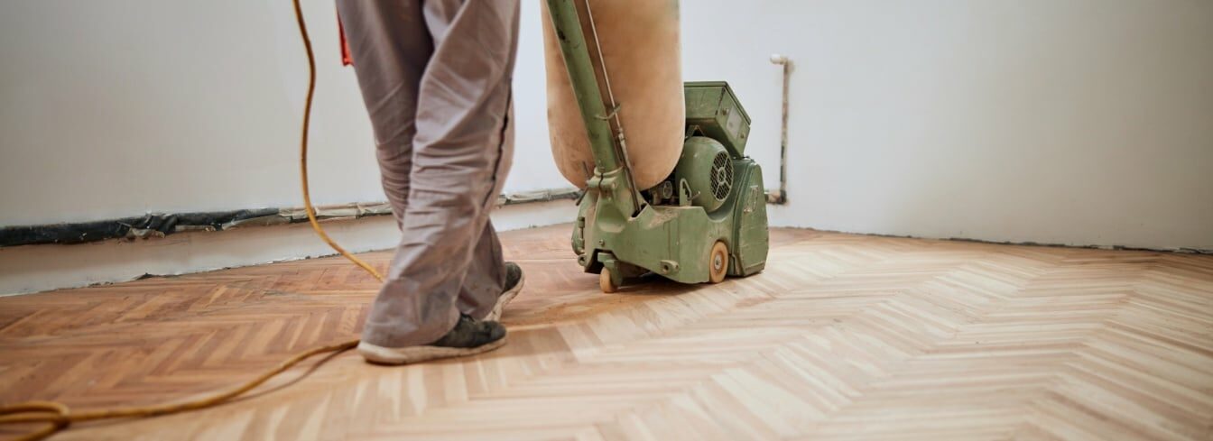 Herringbone floor sanding in progress by Mr Sander® using the powerful Effect 2200 belt sander. Voltage: 230V, Frequency: 50Hz. Size: 200x750mm in Southall, UB1. Dust extraction system with HEPA filter ensures a clean and efficient outcome.
