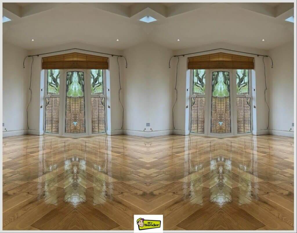 Spacious living room with a herringbone parquet wooden floor in Wembley, UK, showing the results of floor sanding and refinishing by Mr. Sander®.