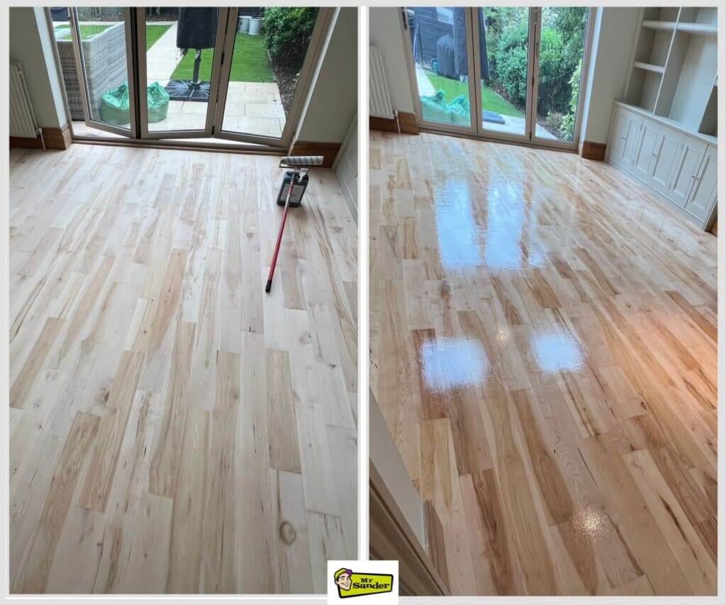 A before and after comparison of a light ash wood floor being sanded and refinished by Mr. Sander®. The left side shows the floor in its raw, unfinished state, with a floor roller nearby, while the right side displays the same floor with a high-gloss finish, beautifully reflecting light from the windows. The room features large glass doors opening to a garden, and white cabinetry on the right adds a clean, modern touch.