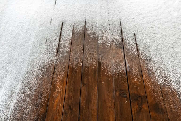 Snow,On,A,Wooden,Plank,Floor,Of,An,Open,Terrace
