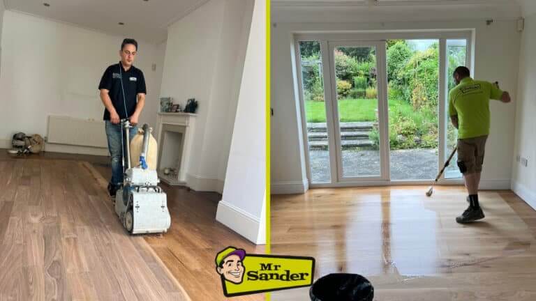 A professional from Mr. Sander® sands a dark parquet floor in a living room using an industrial drum sander, while another worker applies a clear finish to a freshly sanded light wood floor near large windows overlooking a garden. The refinishing process brings out the natural beauty of the wood grain.