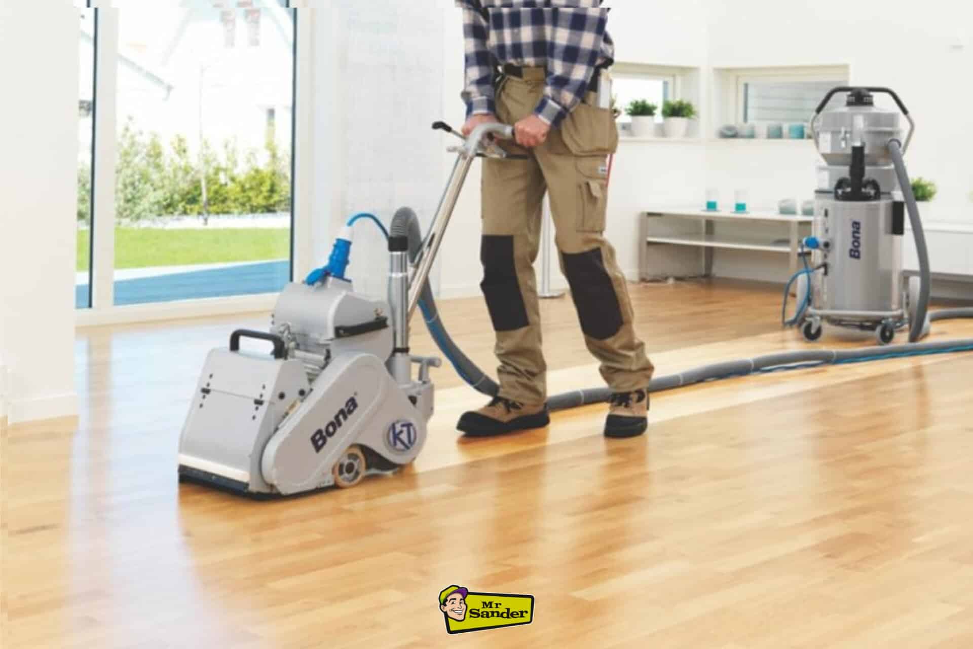 A professional sanding a light oak wooden floor in a modern, bright living space in Hampton Hill using advanced Bona floor sanding equipment, showcasing floor restoration by Mr. Sander.
