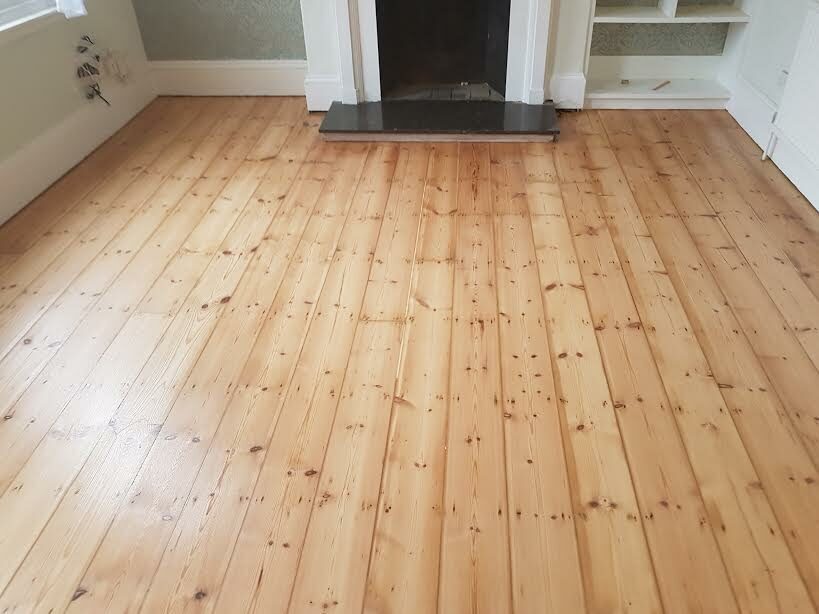 Gorgeous pine flooring, sanded, gaps filled and finished with natural matt lacquer.