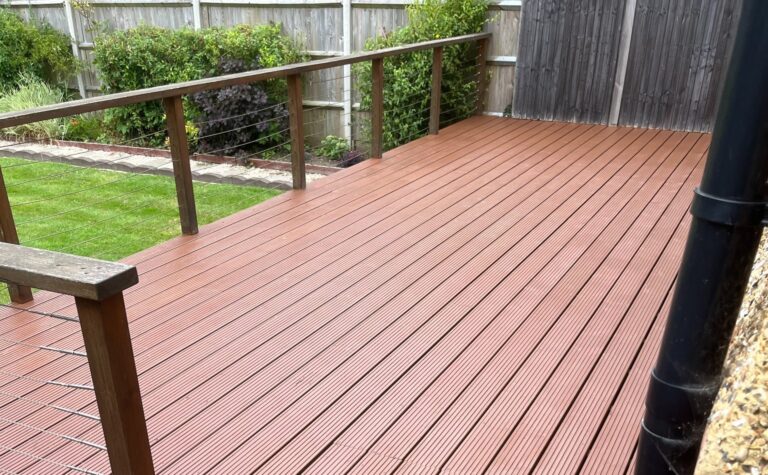 Deck Sanding and Oiling on grooved softwood timber decking, showing a freshly refinished garden deck with a smooth, even stain and clean balustrade.