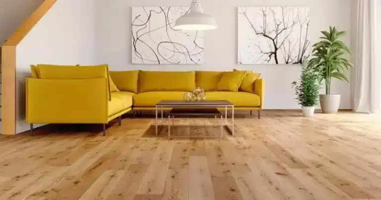 Modern living room with a vibrant yellow sectional sofa, hardwood flooring, and minimalist decor.