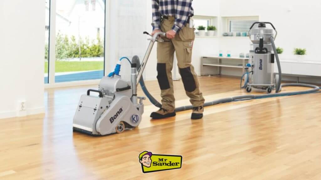 A close-up of a Bona floor sander machine being used on a wooden floor.