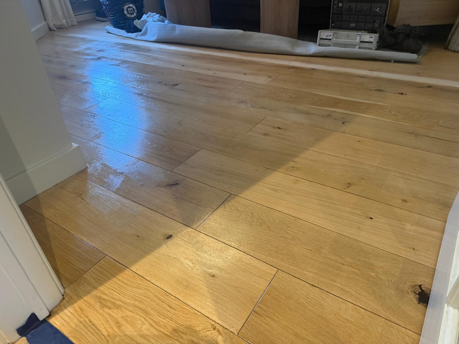 Engineered Wood Floor Repair showing freshly refinished oak engineered wood flooring in a living room, with a smooth, even sheen after professional treatment.