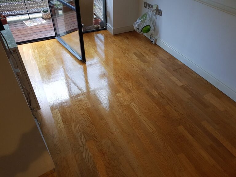 Expert Sanding restoring an engineered oak wood floor, dustless sanded and lacquered to a high-gloss finish with clear grain and even sheen.