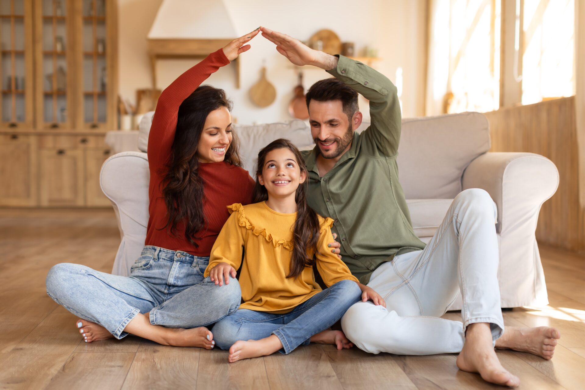 Floor Installation for Allergens – smiling family relaxing barefoot on a wide-plank oak hardwood floor professionally fitted by Mr Sander®