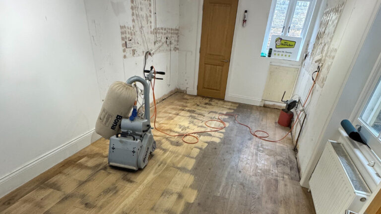 European oak floor mid-sanding; contrast between bright sanded boards and dull worn boards with Bona sander, by Mr Sander®.
