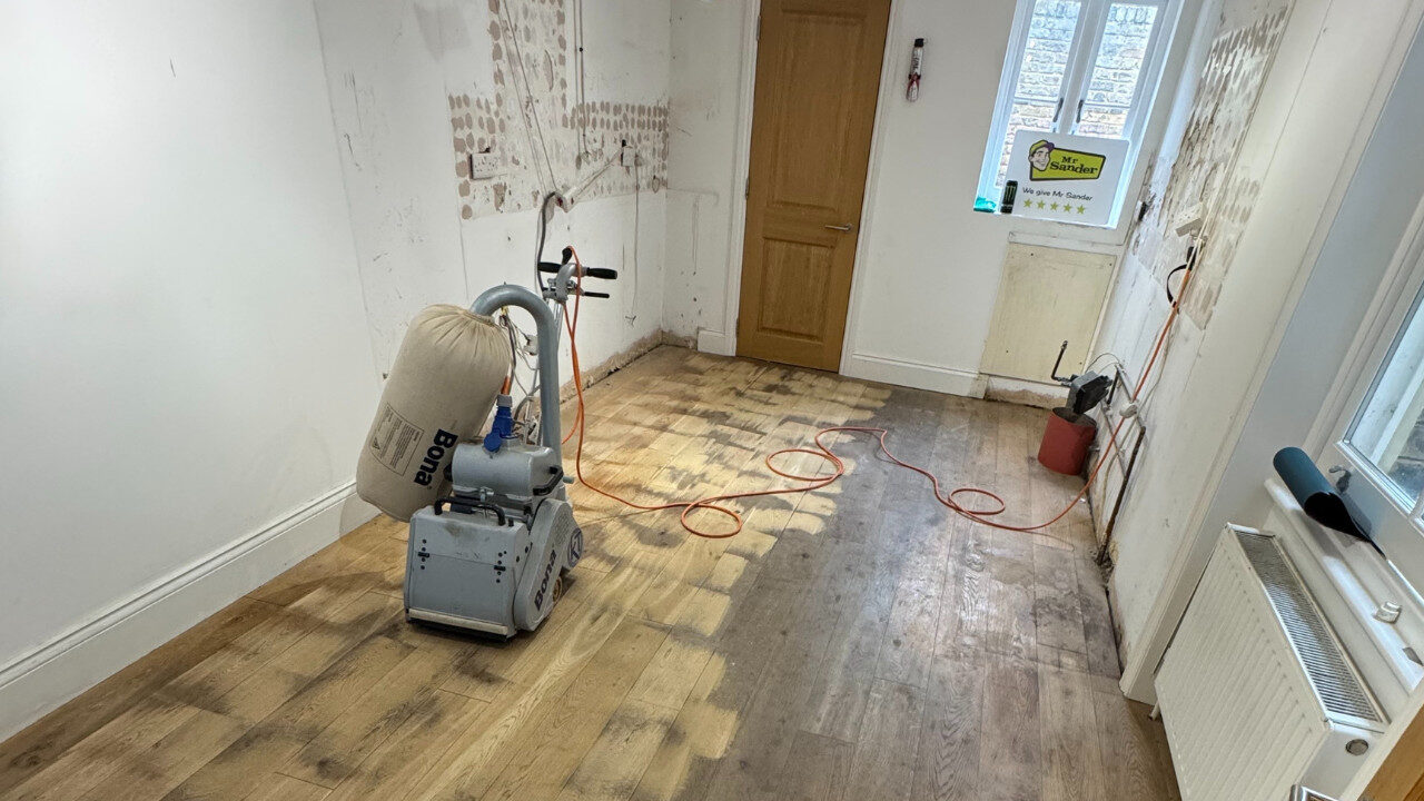 European oak floor mid-sanding; contrast between bright sanded boards and dull worn boards with Bona sander, by Mr Sander®.