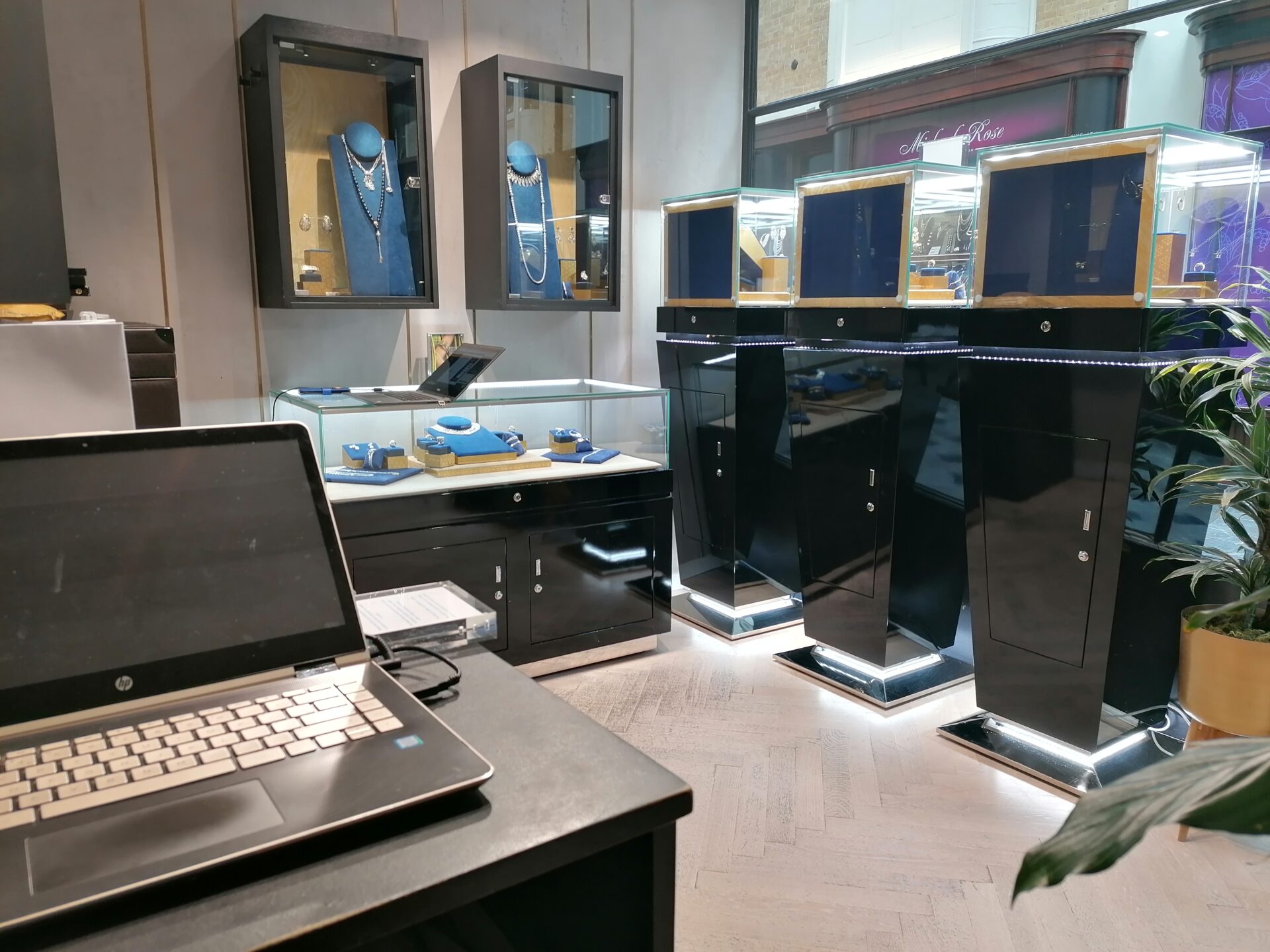 Jewellery boutique—dull herringbone oak parquet before Floor Sanding in Retail Spaces by Mr Sander