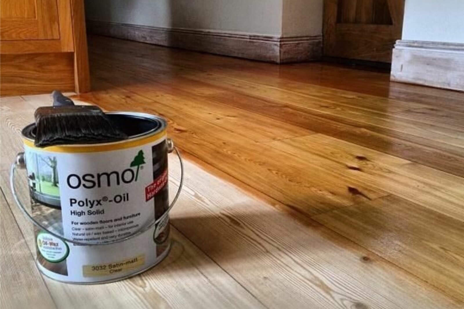 Grief Over Grime solved on pine wood floorboards as Osmo Polyx-Oil hardwax oil with a brush brings dull planks back to life with a satin finish.