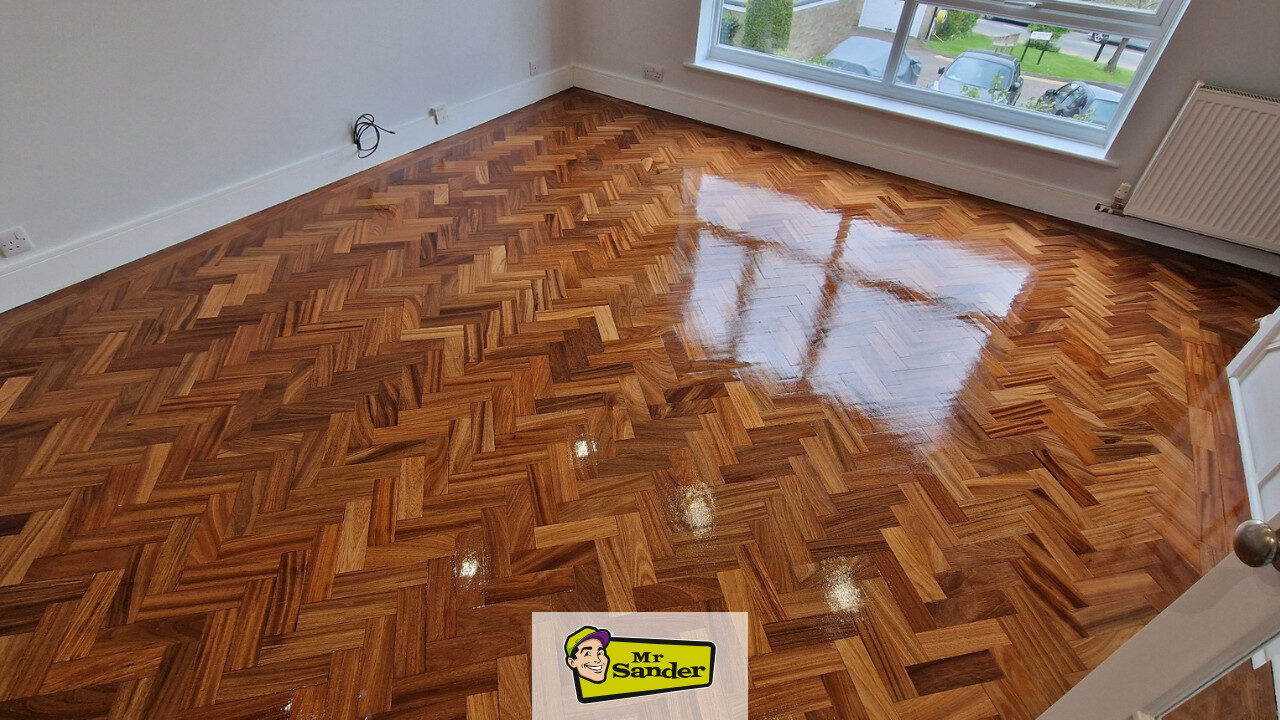 Freshly restored herringbone parquet—sanded, stained and lacquered to a high-gloss finish in Havering RM12 by Mr Sander®.