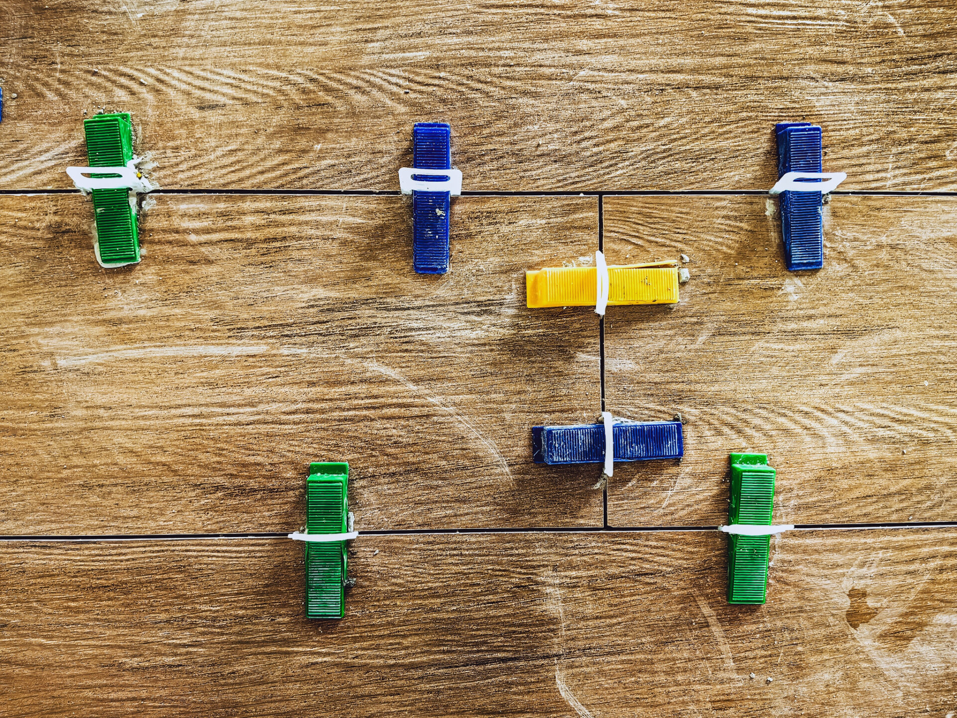 Junckers Floor Fitting — oak hardwood plank floor during installation with levelling clips and spacers for perfect joints and alignment