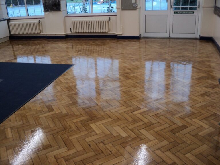Love Your Parquet – herringbone oak parquet wood floor (solid blocks) freshly sanded, gap-filled and lacquered to a smooth, high-gloss finish.