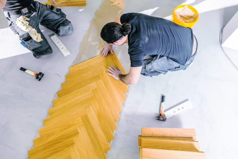 Professional parquet floor installation in herringbone pattern for jewelry stores by Mr Sander®