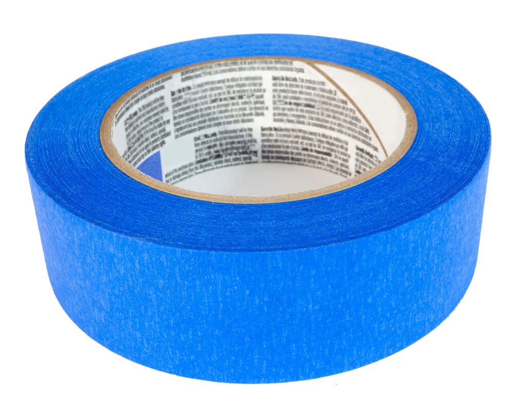 A roll of blue painter's tape isolated on a white background.