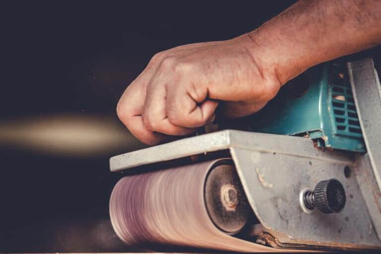 A,Skilled,Carpenter,Is,Using,The,Power,Sander,As,A