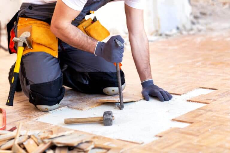 Creative,And,Hard-working,Handyman,Tearing,Down,The,Parquet,Structure
